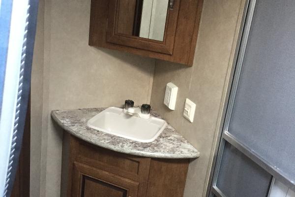 Full Bathroom with tub/shower, sink, vanity, cabinet and mirror