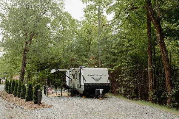 Site #339- 60'L x 30'W, back-in, 50/30 amp, FHU, table and fire ring w/ cooking grate.