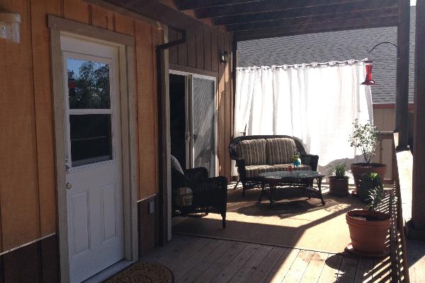 Covered patio with private entrance, patio furniture, BBQ and view of Oak trees