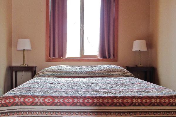 Each bedroom features a comfortable queen sized bed.