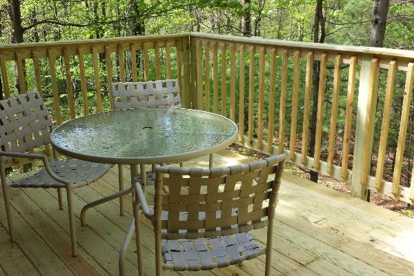 Red Roof Log Cabin With New Deck off of Kitchen Overlooking Wooded Area