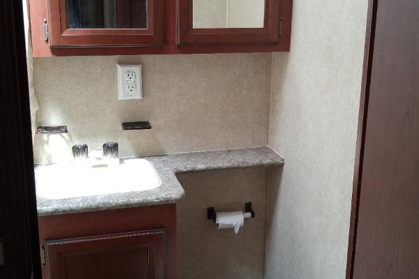 Full Bathroom with tub/shower combo, toilet, sink, cabinents