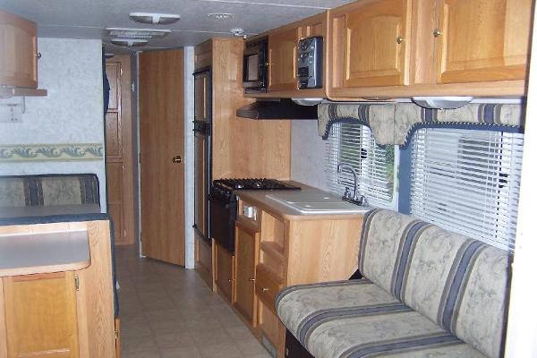 Full Kitchen with fridge, freezer, micro, stove, oven, dbl. sink, couch converts to full bed