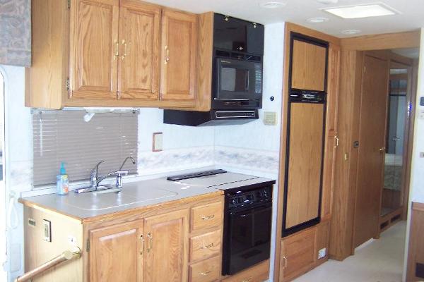 Full kitchen with stove/oven, fridge/freezer, microwave, dbl. sink