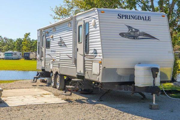 Back in RV Sites ranging from 25' to 55' long with Water and 30 of 50 Amp electric service. with Water on site included.