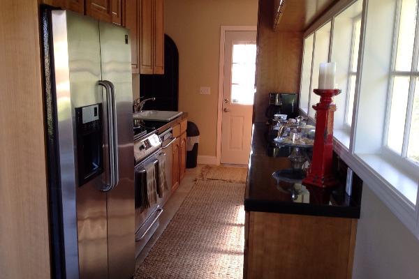 Full kitchen with granite countertops.